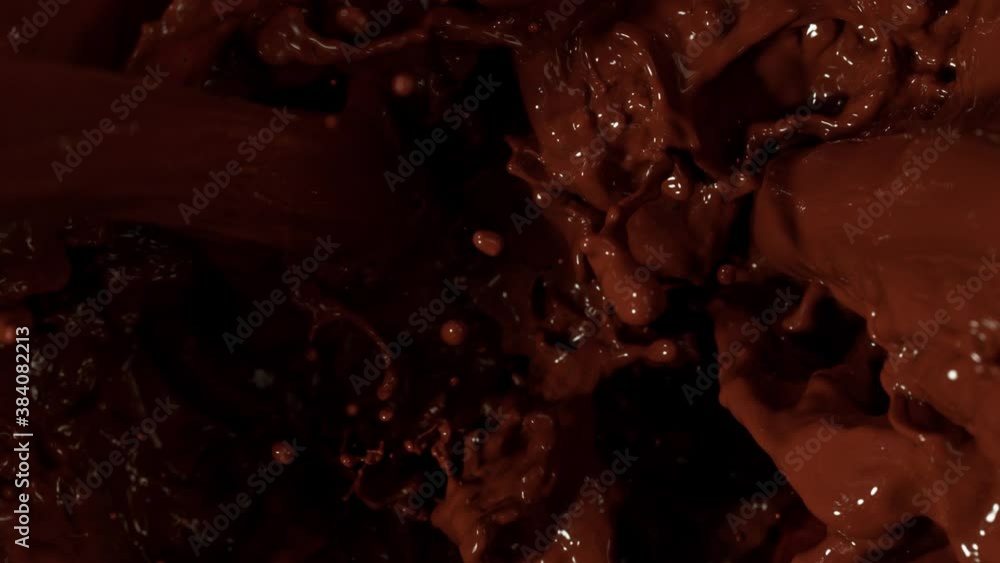 Super Slow Motion Shot of Splashing Melted Chocolate at 1000 fps. Super Slow Motion Shot of Splashing Melted Chocolate at 1000 fps.