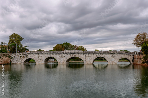The ancient Tiberius Bridge in the historic center of Rimini, Emilia Romagna, Italy