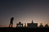 man next to silhouette skyline of madrid city in spain