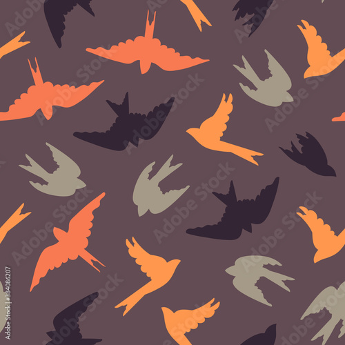 Seamless pattern with migrating birds. Colored birds on a purple background. Surface design. Vector illustration.