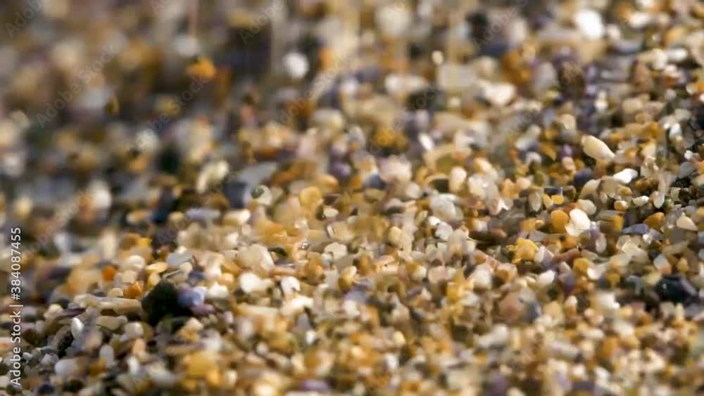 Close shot of spreading and falling tiny pebbles and sand stones on the floor and view of amazing colours in the nature, Close shot of spreading and falling tiny pebbles and sand stones on the floor and view of amazing colours in the nature,