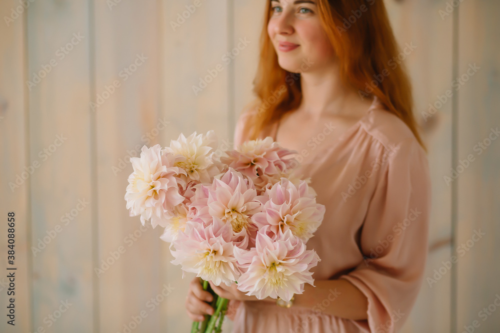 Asters in female hands a gift bouquet of flowers Asters in female hands a gift bouquet of flowers
