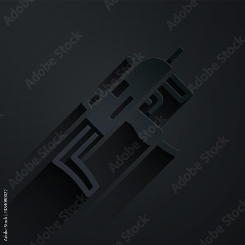 Paper cut MP9 submachine gun icon isolated on black background. Automatic weapon. Paper art style. Vector.