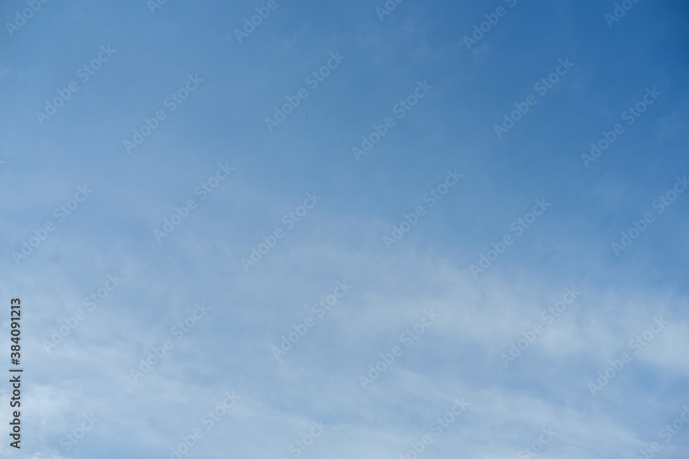 Sky with white clouds pattern background. Sky and clouds in daylight. Outdoor natural background.