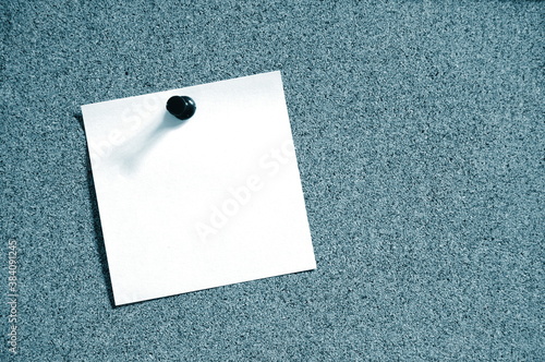 blank sheet paper on bulletin board photo