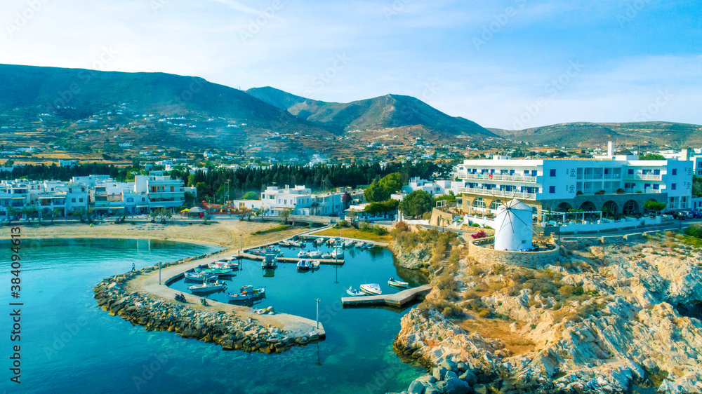 Aerial view of harbor, mountains and living homes at Paros island
