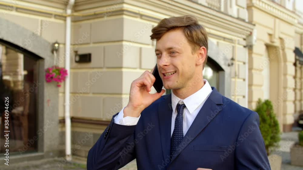 Portrait of positive businessman celebrating victory outdoors Portrait of positive businessman celebrating victory outdoors