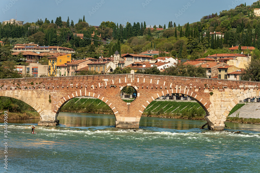 Stone bridge (Ponte Pietra) 1th century B.C. The oldest Roman monument in Verona, UNESCO world heritage site, and the river Adige, Veneto, Italy, Europe.