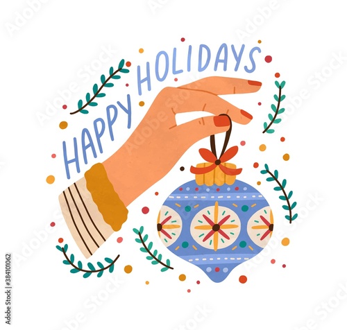 Xmas greeting card decorated with confetti, bauble and branches of mistletoe. Female hand decorating or holding christmas tree decoration. Vector flat cartoon illustration isolated on white