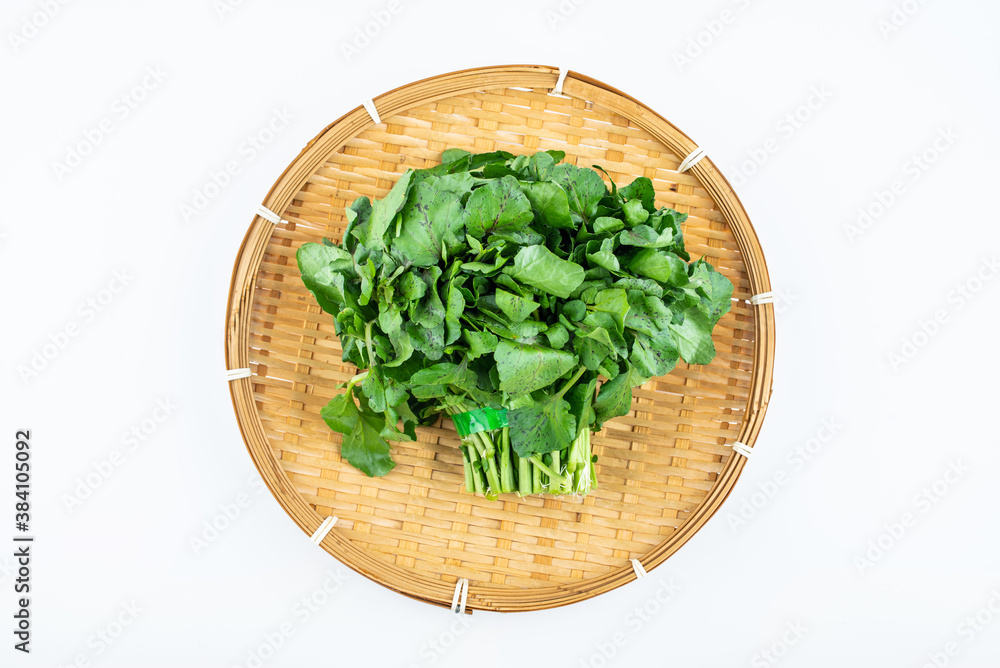 Handful of fresh green vegetable watercress on white background Handful of fresh green vegetable watercress on white background