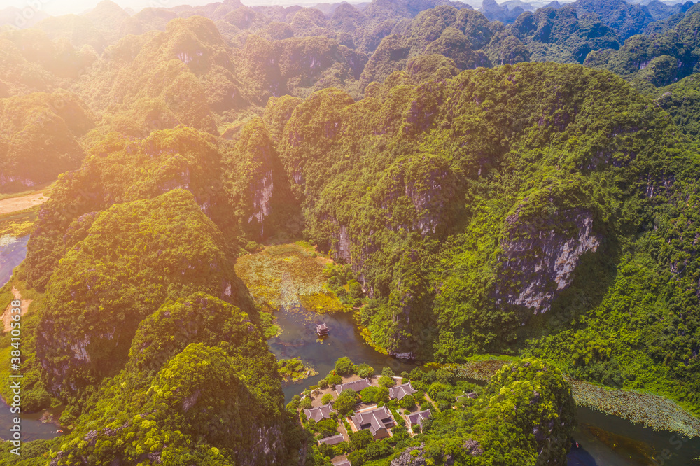 Aerial view of natural scenery at Trang An landscape complex. Trang An is UNESCO World Heritage Site, renowned for its boat cave tours. It's Halong Bay on land of Vietnam.
