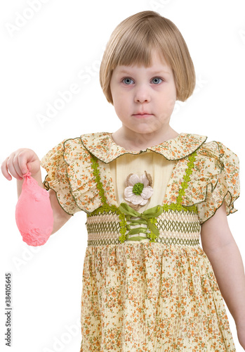 Foto Little girl with blowing off balloon