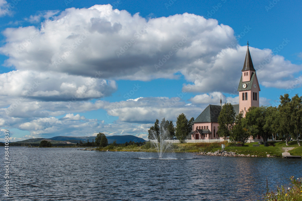 Pink church by the lake in the Swedish town Arjeplog