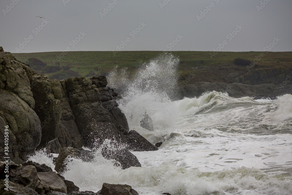 Dark moody autumn seascape landscape, stormy Black Sea, Bulgaria. Splashing sea waves and harsh cold windy weather Dark moody autumn seascape landscape, stormy Black Sea, Bulgaria. Splashing sea waves and harsh cold windy weather