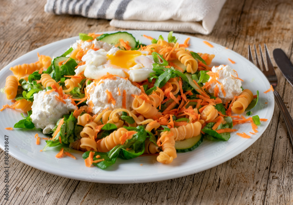 salad with lentil noodles an raw vegetable on a plate salad with lentil noodles an raw vegetable on a plate