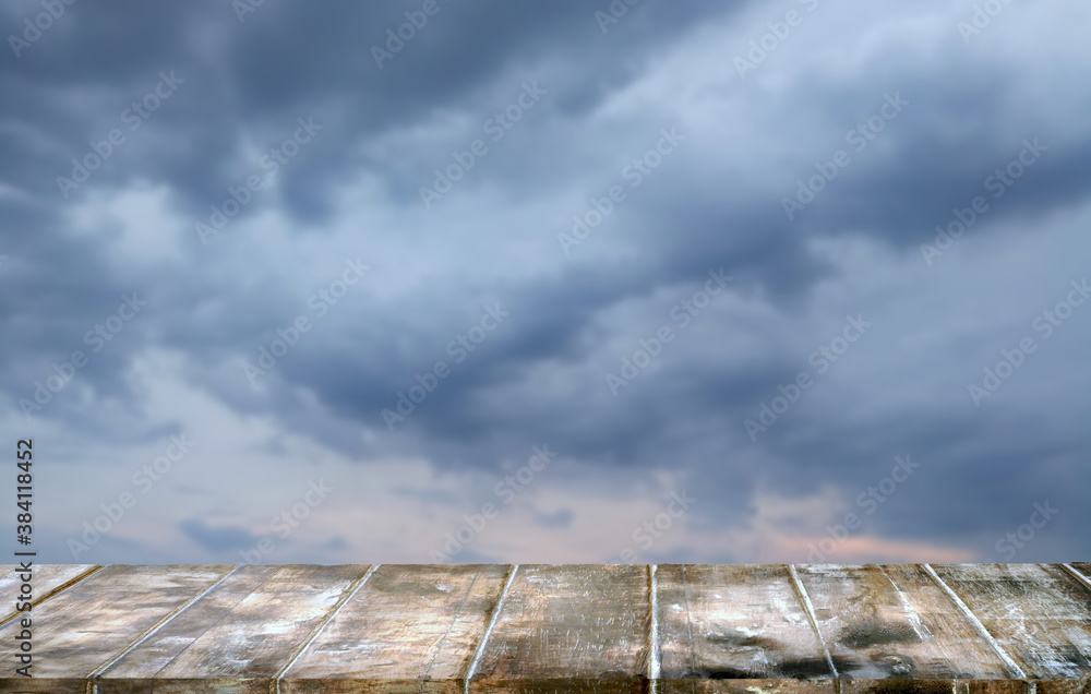Mockup  empty top wood table.Background storm sky cloud 
