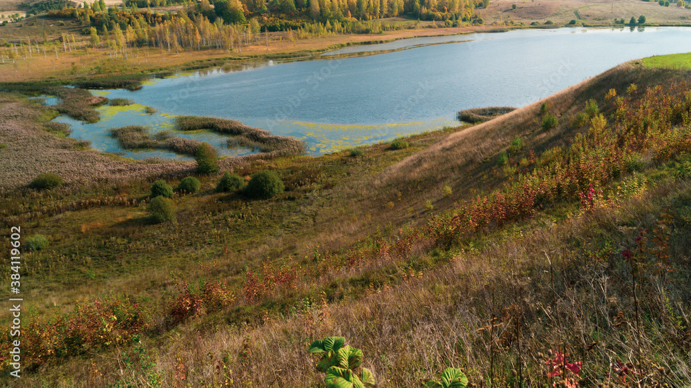 Lake in the valley aerial view. golden autumn