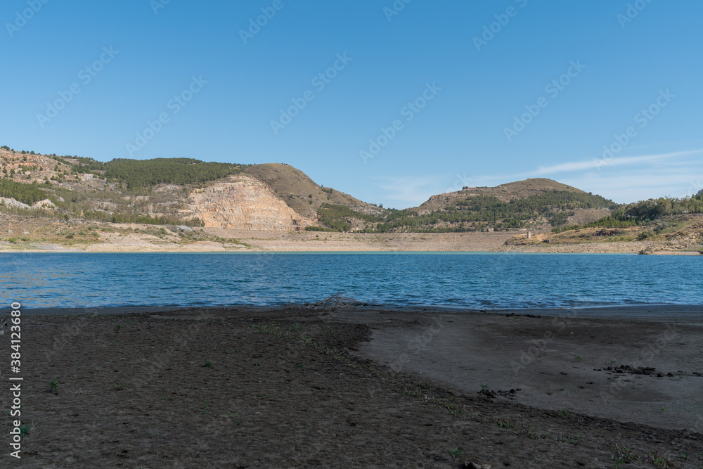 Beninar reservoir surrounded by mountains Beninar reservoir surrounded by mountains