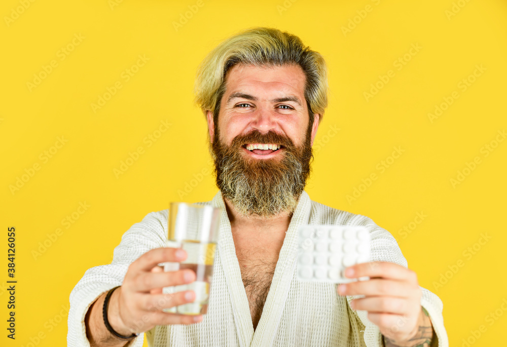 try this. diseased man on quarantine. drink water glass. flu and cold. he has temperature. coronavirus prevention. stay home on lockdown. hipster man on self isolation. sick man on yellow background. try this. diseased man on quarantine. drink water glass. flu and cold. he has temperature. coronavirus prevention. stay home on lockdown. hipster man on self isolation. sick man on yellow background.