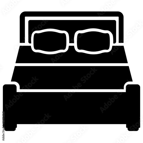 
A king size bed with beautiful bed sheet to sleep on ir 
