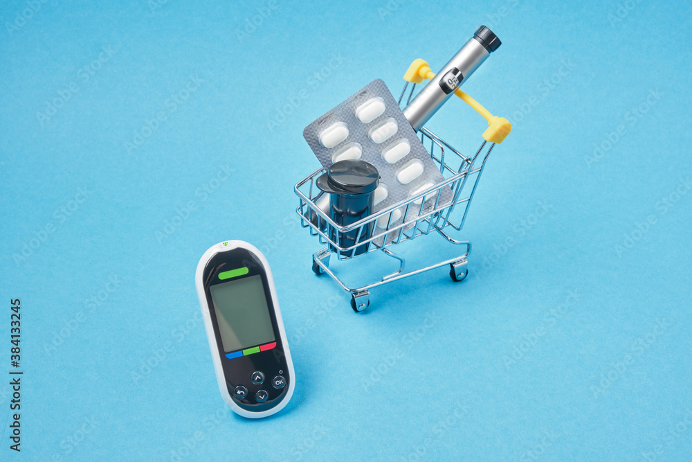 media Postscript Exert Diabetes concept. Diabetic supplies in shop trolley on a blue background.  Stock Photo | Adobe Stock