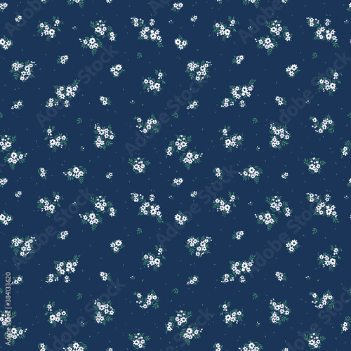 Seamless floral pattern for design. Small white flowers.  Navy  blue background. Modern floral pattern. elegant template for fashion prints.