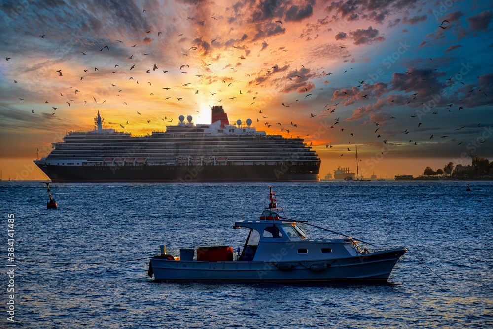 The dinghy boat eastward in İstanbul Bosphorus on a beautiful sunset day. Cruise ship in the