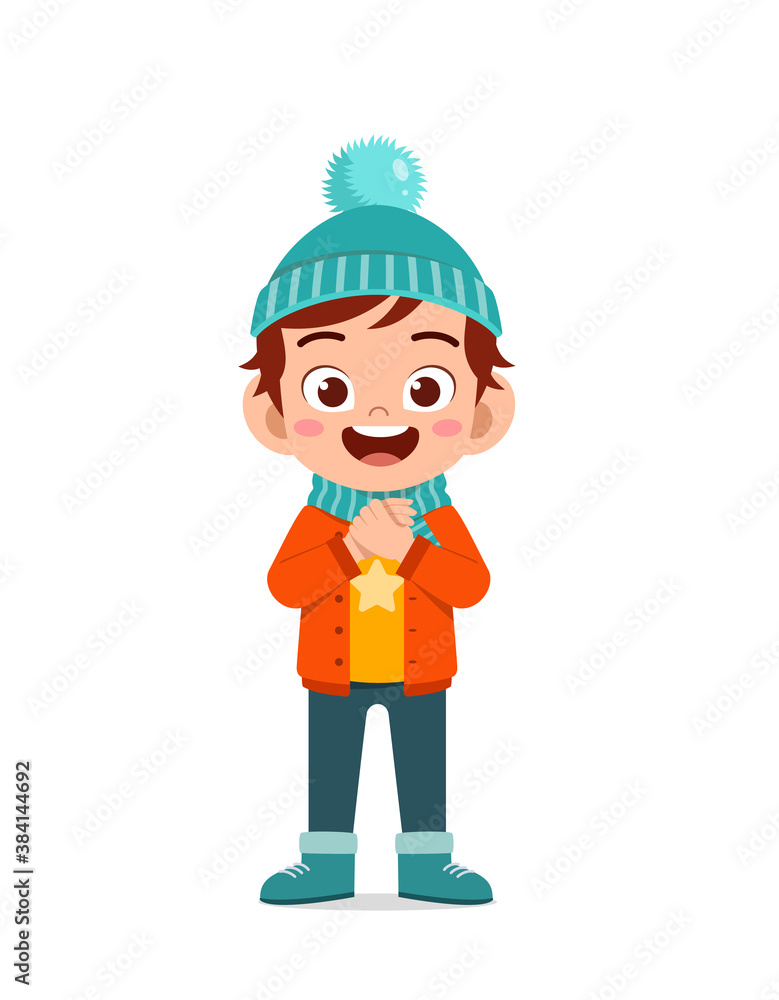 happy cute little kid play and wear jacket in winter season. child smile wearing warm clothes