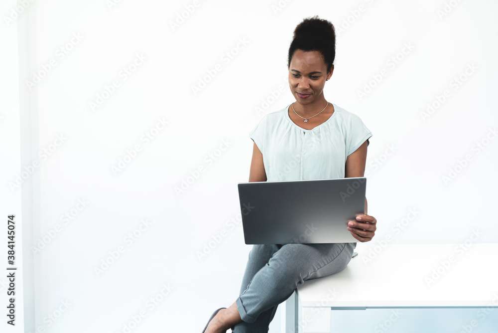 Woman working on laptop over white background Woman working on laptop over white background