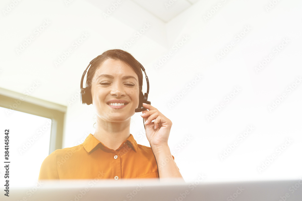 Happy businesswoman with headphones at office Happy businesswoman with headphones at office