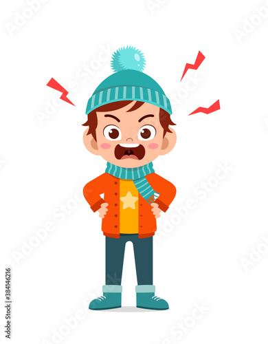 angry cute little kid scream and wear jacket in winter season. child shout wearing warm clothes