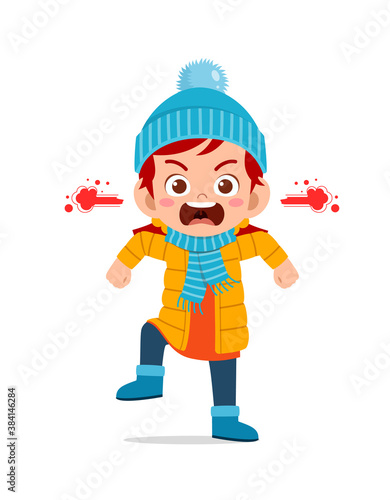 angry cute little kid scream and wear jacket in winter season. child shout wearing warm clothes