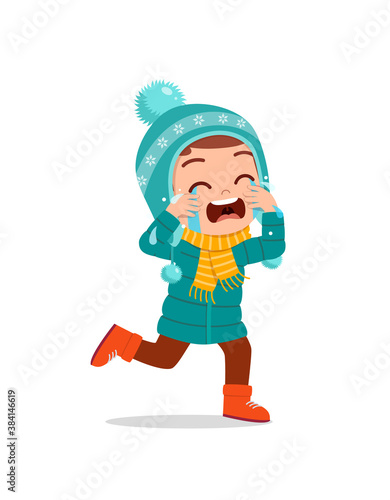 sad cute little kid cry and wear jacket in winter season. child scream crying wearing warm clothes