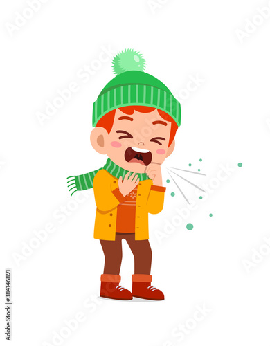 sad cute little kid cough and wear jacket in winter season. child feeling sick wearing warm clothes