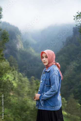 Beautiful asian muslim girl at Kali Talang, Yogyakarta, Indonesia photo