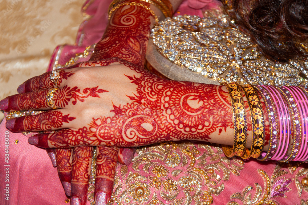 Henna tattoo on the hands of Indian bride