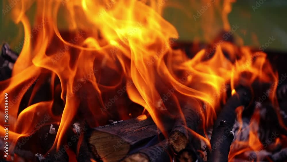 Detailed fire flame. Bright flame from wooden logs. Orange fire burning. Slow motion. Detailed fire flame. Bright flame from wooden logs. Orange fire burning. Slow motion.