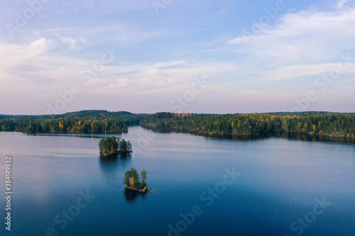 Fototapeta Naklejka Na Ścianę i Meble -  Drone shot of islands, lake and forest in autumn in Heinola, Finland