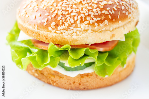 Burger with lettuce and sesame seed bun