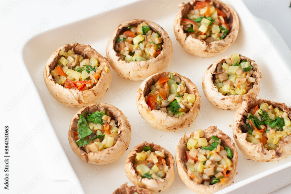 Stuffed mushrooms with vegetables on a baking dish. Vegetarian food