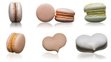 Different kinds of macarons on a white background