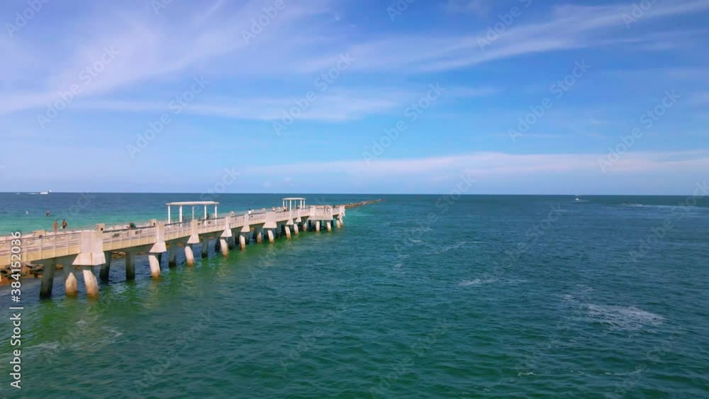Drone shot around the South Pointe park Pier at the Miami beach, sunny day, Florida, USA - pan, Aerial view Drone shot around the South Pointe park Pier at the Miami beach, sunny day, Florida, USA - pan, Aerial view