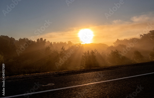 Foggy Landscape.Early Morning Mist. background of the sun.