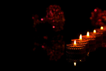 Indian festival diwali , candle on dark background