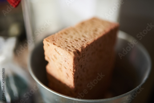 A sponge in a bucket at a school