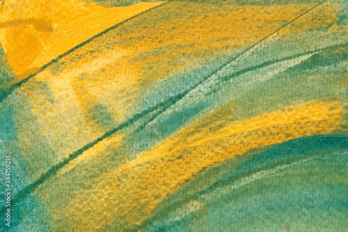 Hand painted green and yellow watercolor background. Colorful abstract acrylic texture. Blue with yellow watercolor blending. The color splashing on the paper. For wallpaper, web banner and any design