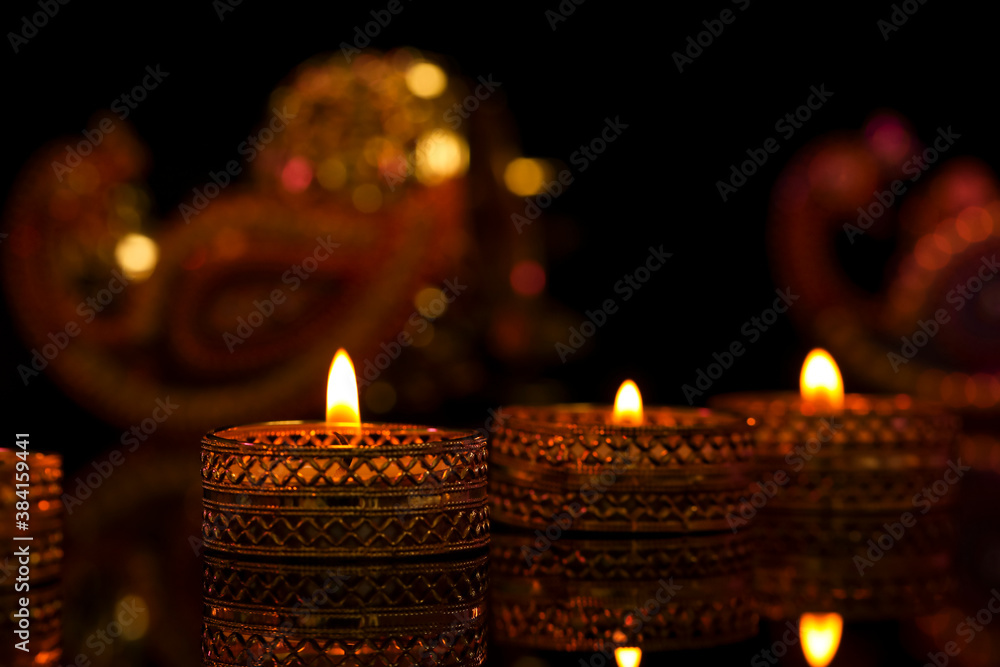 Indian festival diwali , candle on dark background Indian festival diwali , candle on dark background