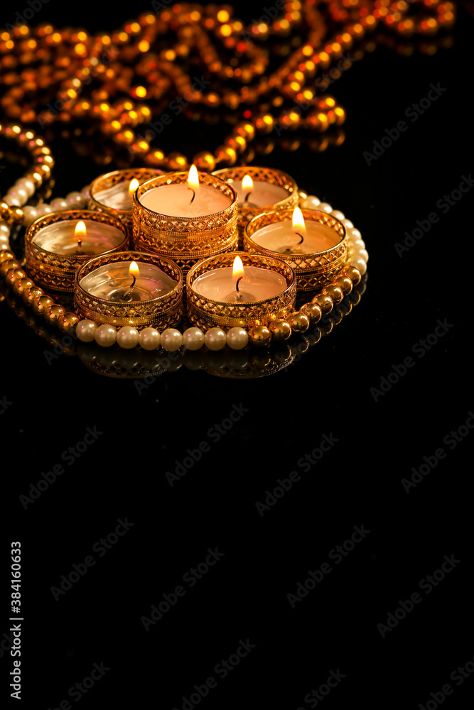 Indian festival diwali , candle on dark background Indian festival diwali , candle on dark background