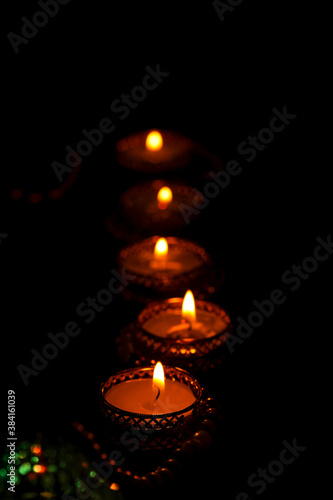 Indian festival diwali , candle on dark background © Niks Ads