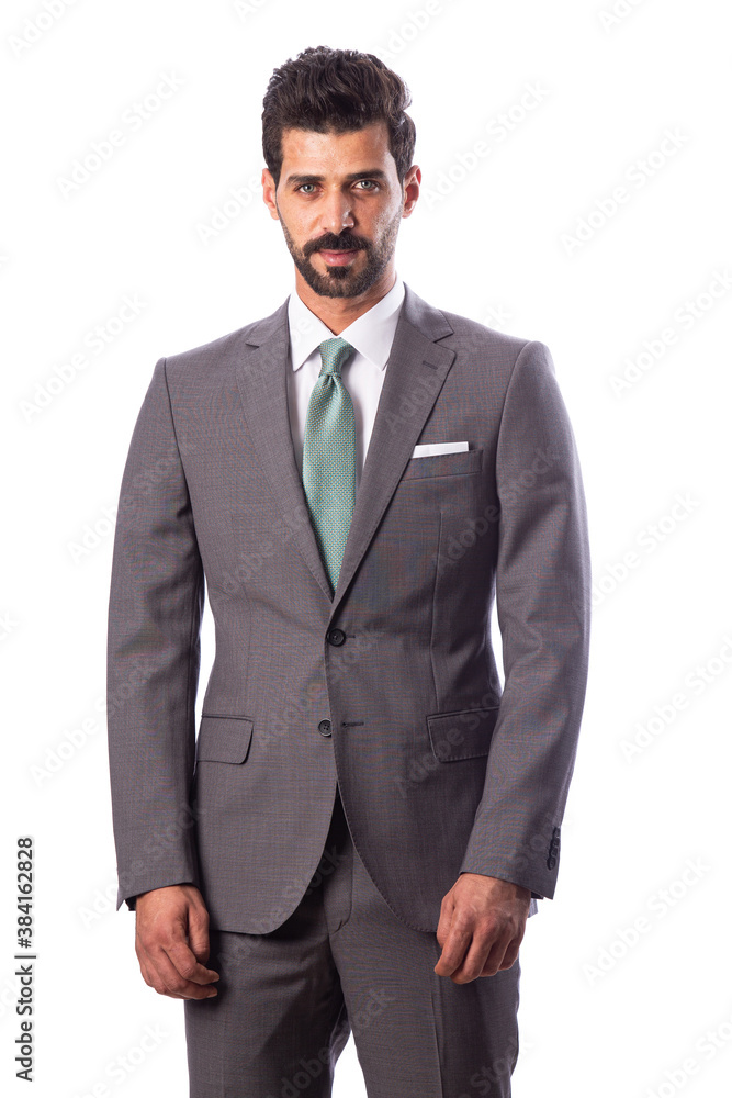 A young man wearing a black suit on a white background A young man wearing a black suit on a white background